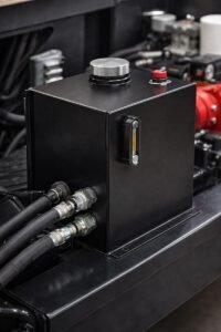 2-gallon hydraulic reservoir tank mounted horizontally with suction and return ports